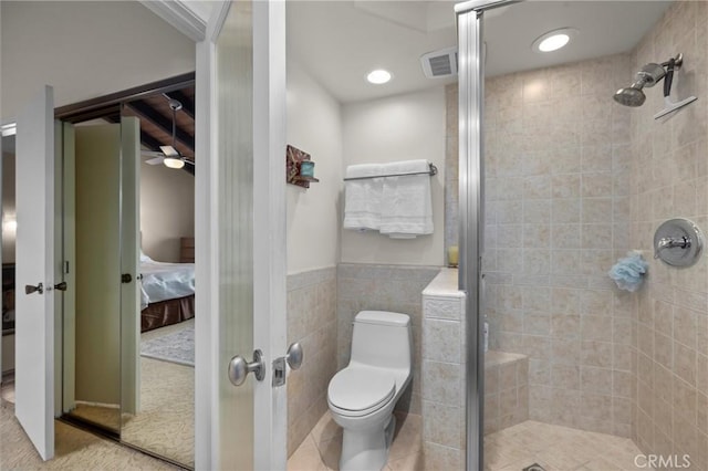 504 Harkness Ln Unit 1, Redondo Beach, CA 90278 - bathroom with ensuite bathroom, a stall shower, tile walls, and a wainscoted wall
