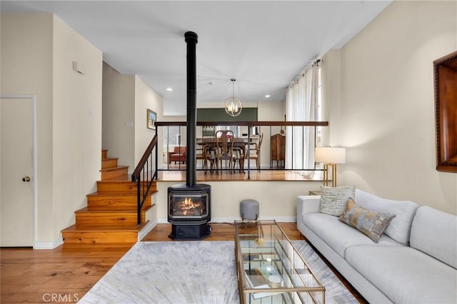 504 Harkness Ln Unit 1, Redondo Beach, CA 90278 - living room with a wood stove, plenty of natural light, wood finished floors, and recessed lighting