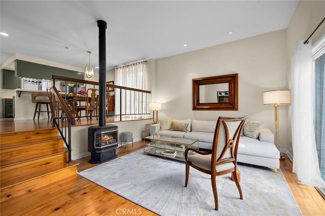 504 Harkness Ln Unit 1, Redondo Beach, CA 90278 - living area featuring a wood stove, wood-type flooring, plenty of natural light, and recessed lighting