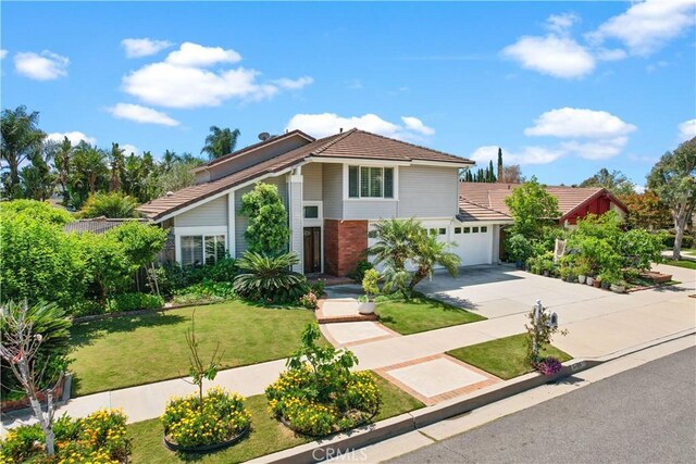 5706 E Bryce Ave, Orange, CA 92867 - view of front of house with a garage, driveway, a front yard, and a tile roof