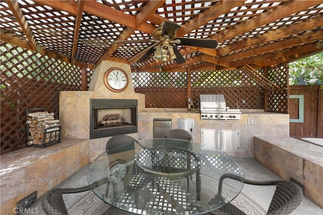 5706 E Bryce Ave, Orange, CA 92867 - view of patio featuring a tile fireplace, outdoor dining area, an outdoor kitchen, a ceiling fan, and a pergola