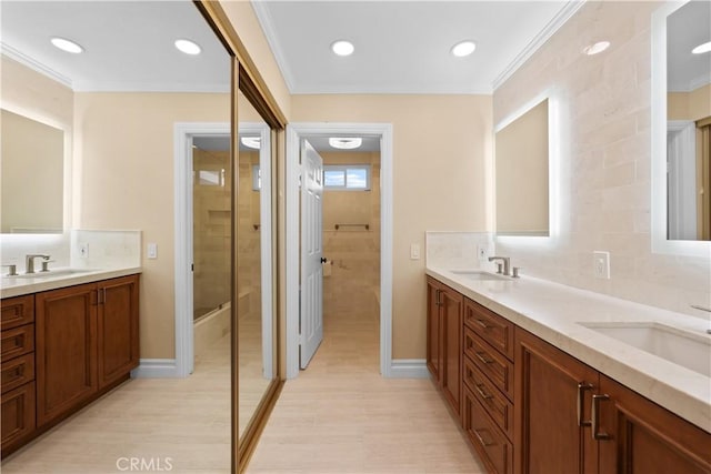 5706 E Bryce Ave, Orange, CA 92867 - full bathroom with double vanity, a shower, crown molding, tasteful backsplash, and wood finished floors
