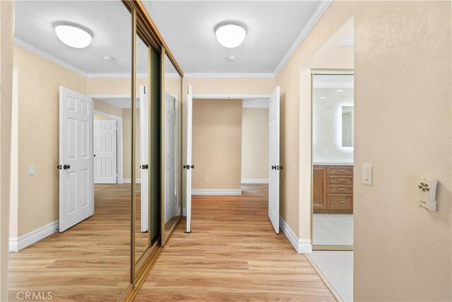 5706 E Bryce Ave, Orange, CA 92867 - hallway with ornamental molding and light wood-style flooring