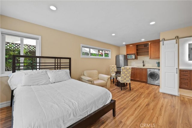 5706 E Bryce Ave, Orange, CA 92867 - bedroom with washer / dryer, freestanding refrigerator, multiple windows, light wood-type flooring, and recessed lighting