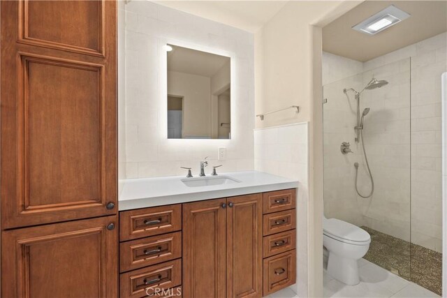 5706 E Bryce Ave, Orange, CA 92867 - bathroom featuring vanity, a tile shower, and tile patterned flooring
