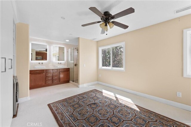 5706 E Bryce Ave, Orange, CA 92867 - bathroom featuring ceiling fan, double vanity, and a shower stall