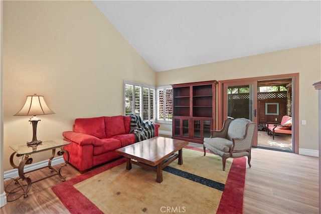 5706 E Bryce Ave, Orange, CA 92867 - living room with wood finished floors and high vaulted ceiling