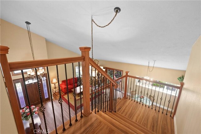 5706 E Bryce Ave, Orange, CA 92867 - staircase featuring a chandelier and wood finished floors