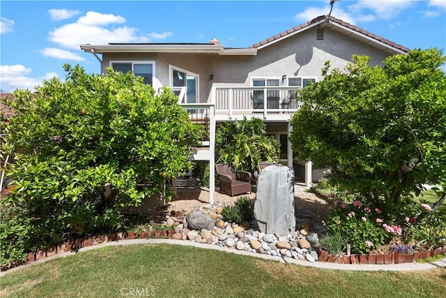 5706 E Bryce Ave, Orange, CA 92867 - back of property featuring stucco siding, a lawn, and a deck