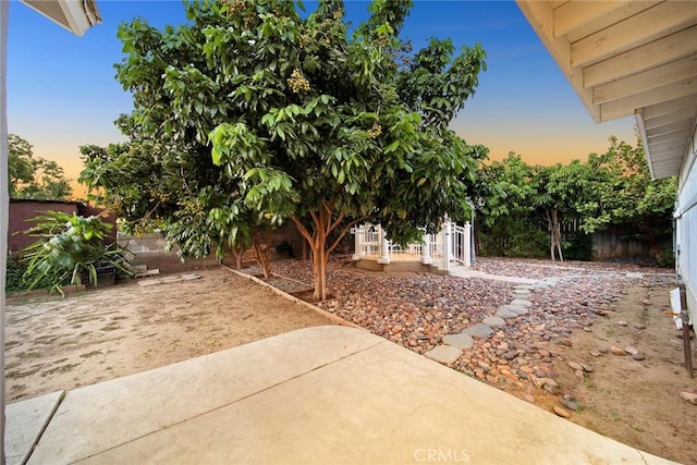 12077 Conference St, El Monte, CA 91732 - yard at dusk featuring a patio and a fenced backyard