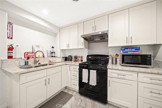 12077 Conference St, El Monte, CA 91732 - kitchen with under cabinet range hood, black gas range, stainless steel microwave, a peninsula, and white cabinetry