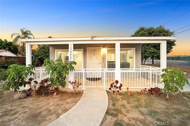 12077 Conference St, El Monte, CA 91732 - view of front of property featuring a porch and stucco siding