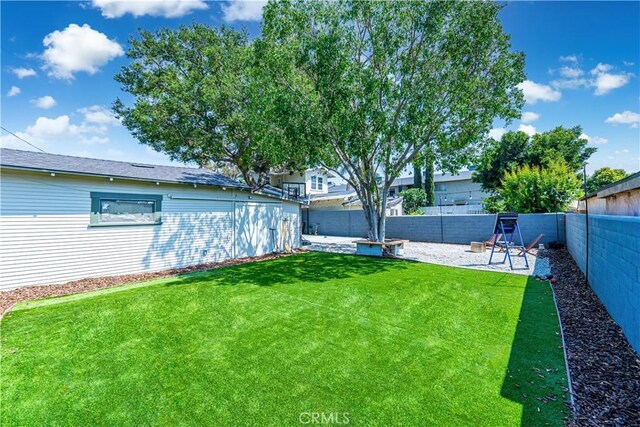 201 S Spruce St, Montebello, CA 90640 - fenced backyard featuring a patio area