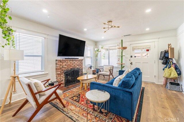 201 S Spruce St, Montebello, CA 90640 - living area featuring wood finished floors, recessed lighting, and a fireplace