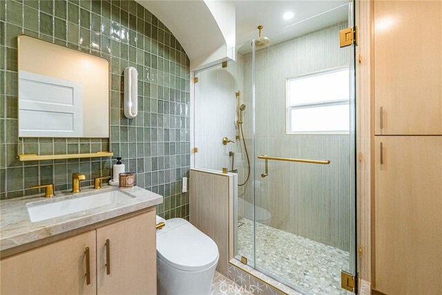 201 S Spruce St, Montebello, CA 90640 - bathroom featuring tile walls, a stall shower, and vanity