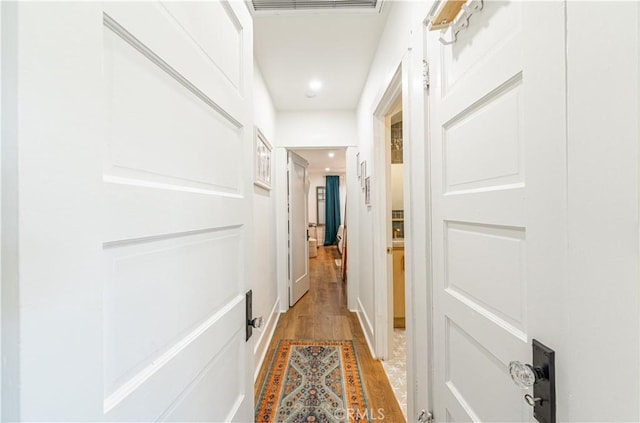 201 S Spruce St, Montebello, CA 90640 - corridor with light wood-style floors and recessed lighting