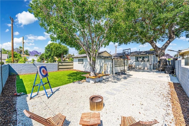 201 S Spruce St, Montebello, CA 90640 - fenced backyard featuring a patio area
