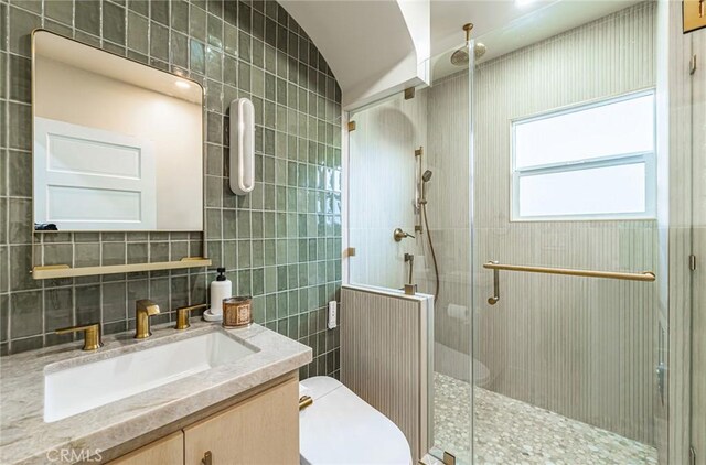 201 S Spruce St, Montebello, CA 90640 - full bath featuring tile walls, vanity, and a stall shower