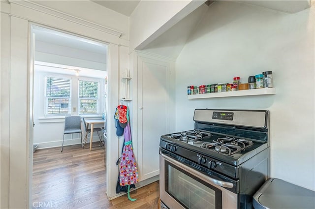 201 S Spruce St, Montebello, CA 90640 - kitchen featuring stainless steel gas range and wood finished floors