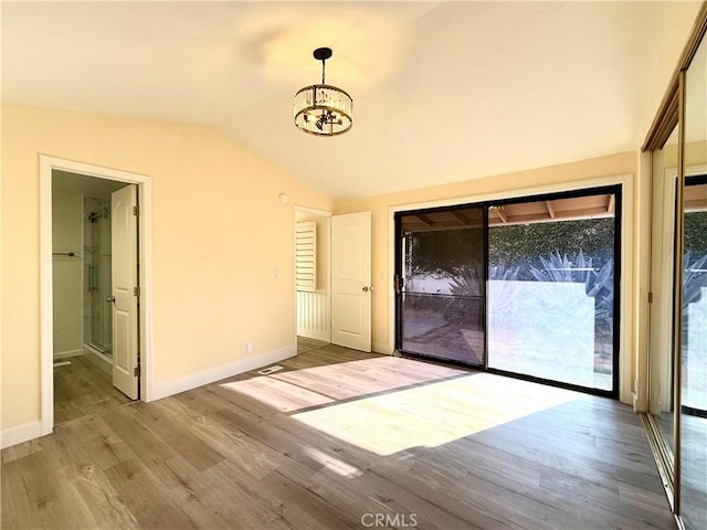 1639 Winn Ct, Pomona, CA 91768 - unfurnished dining area with a chandelier, lofted ceiling, and wood finished floors