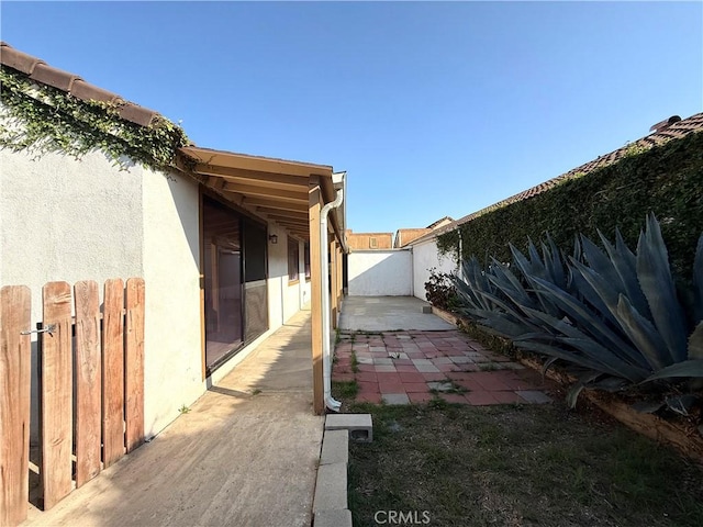 1639 Winn Ct, Pomona, CA 91768 - view of property exterior featuring stucco siding, a fenced backyard, and a patio area