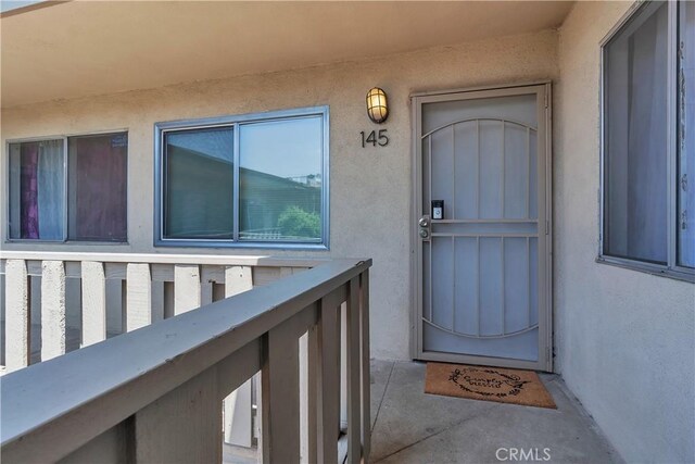 3265 Santa Fe Ave Unit 145, Long Beach, CA 90810 - property entrance with stucco siding