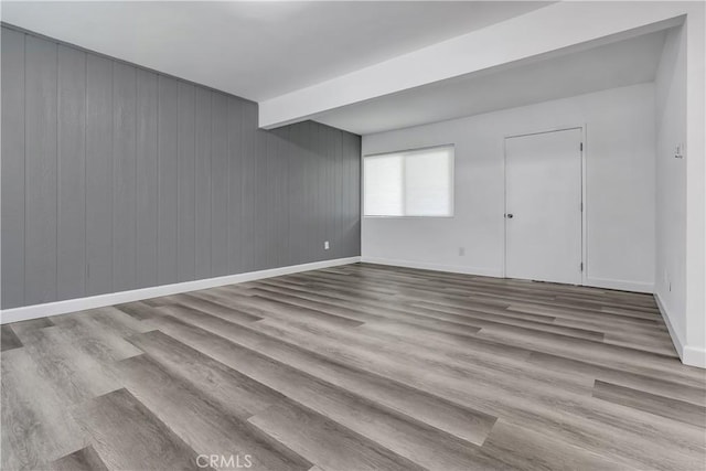 3265 Santa Fe Ave Unit 145, Long Beach, CA 90810 - spare room featuring wood finished floors and wood walls