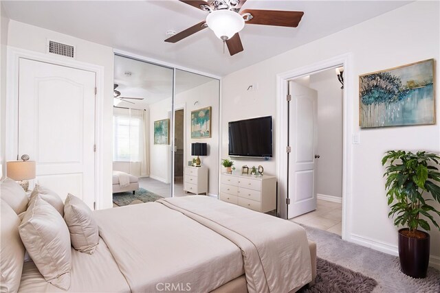 24302 Vista Ridge Dr, Valencia, CA 91355 - bedroom with light carpet, ceiling fan, and a closet