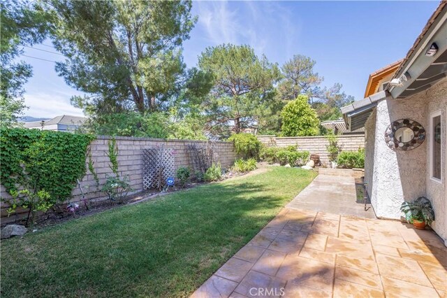 24302 Vista Ridge Dr, Valencia, CA 91355 - fenced backyard featuring a patio