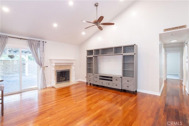 24302 Vista Ridge Dr, Valencia, CA 91355 - unfurnished living room with high vaulted ceiling, ceiling fan, light wood finished floors, a high end fireplace, and recessed lighting