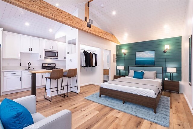 24302 Vista Ridge Dr, Valencia, CA 91355 - bedroom with recessed lighting, light wood-style floors, beam ceiling, a spacious closet, and high vaulted ceiling