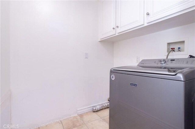 24302 Vista Ridge Dr, Valencia, CA 91355 - laundry area with washer / clothes dryer, cabinet space, and light tile patterned floors