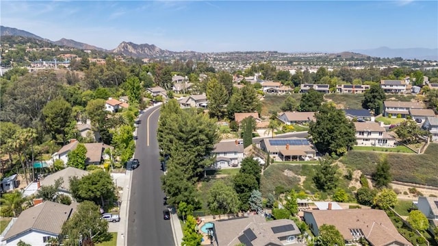 24302 Vista Ridge Dr, Valencia, CA 91355 - aerial view of property's location with a mountain backdrop and nearby suburban area