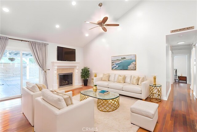 24302 Vista Ridge Dr, Valencia, CA 91355 - living room featuring ceiling fan, wood finished floors, recessed lighting, a glass covered fireplace, and high vaulted ceiling