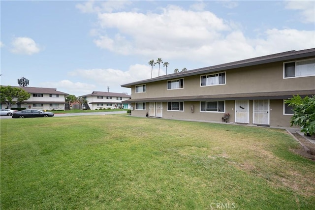 11861 Bailey St, Garden Grove, CA 92845 - back of property featuring stucco siding and a lawn