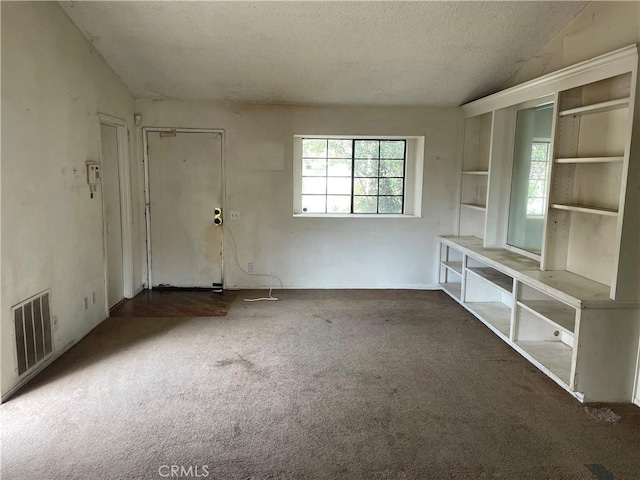 6106 Pathfinder Rd, Riverside, CA 92504 - carpeted empty room with vaulted ceiling and a textured ceiling