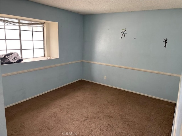 6106 Pathfinder Rd, Riverside, CA 92504 - carpeted spare room with a textured ceiling and baseboards