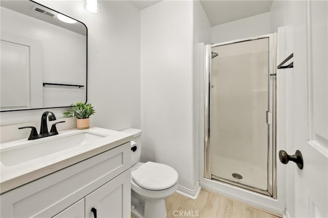 305 W Duarte Rd Unit G, Monrovia, CA 91016 - bathroom featuring a stall shower, vanity, and wood finished floors
