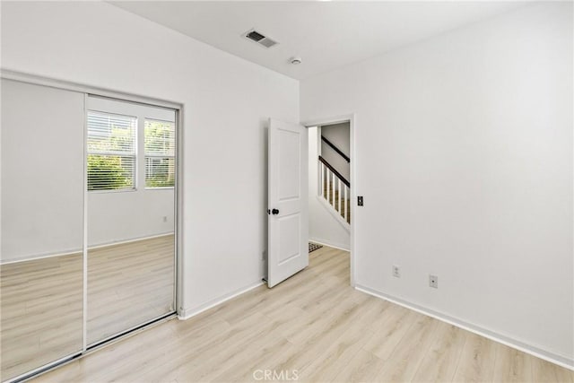 305 W Duarte Rd Unit G, Monrovia, CA 91016 - unfurnished bedroom featuring light wood-style floors and a closet