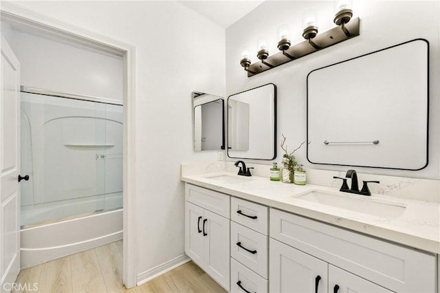 305 W Duarte Rd Unit G, Monrovia, CA 91016 - bathroom with wood finished floors, double vanity, and washtub / shower combination