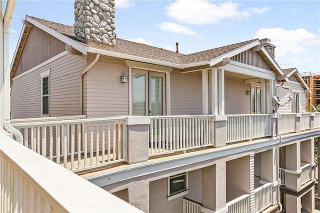 305 W Duarte Rd Unit G, Monrovia, CA 91016 - view of property exterior with a chimney, a balcony, and roof with shingles