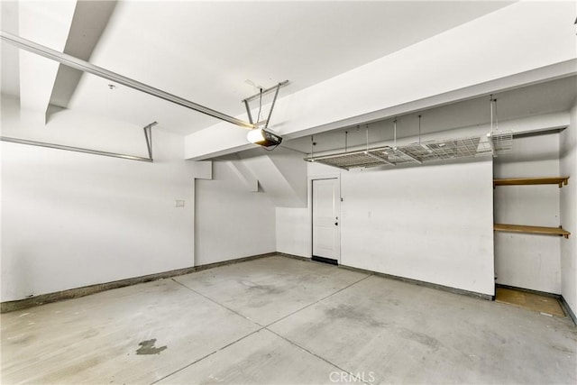 305 W Duarte Rd Unit G, Monrovia, CA 91016 - garage featuring a garage door opener and baseboards