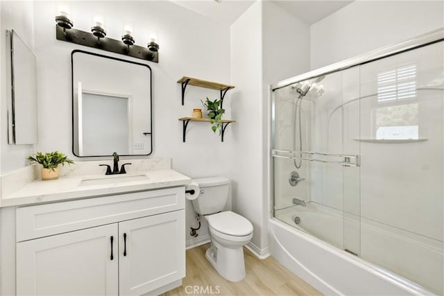 305 W Duarte Rd Unit G, Monrovia, CA 91016 - bathroom with vanity, wood finished floors, and shower / bath combination with glass door