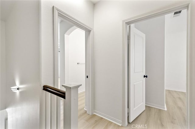 305 W Duarte Rd Unit G, Monrovia, CA 91016 - corridor with light wood-style flooring and an upstairs landing