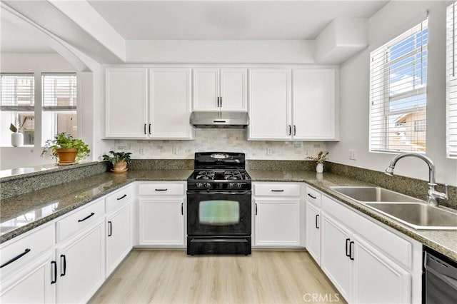 305 W Duarte Rd Unit G, Monrovia, CA 91016 - kitchen with black gas range, under cabinet range hood, white cabinets, and dishwasher