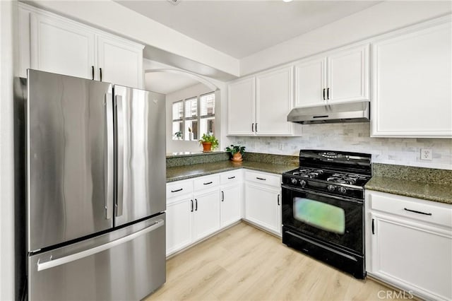 305 W Duarte Rd Unit G, Monrovia, CA 91016 - kitchen featuring freestanding refrigerator, black range with gas stovetop, under cabinet range hood, and white cabinetry