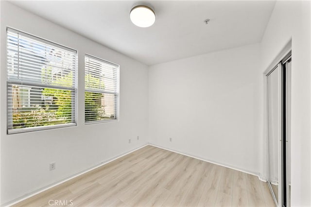 305 W Duarte Rd Unit G, Monrovia, CA 91016 - unfurnished bedroom with light wood-type flooring and a closet