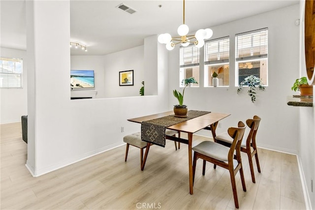 305 W Duarte Rd Unit G, Monrovia, CA 91016 - dining space with wood finished floors and a chandelier