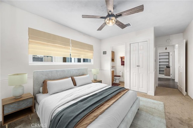 7028 E Parkcrest St, Long Beach, CA 90808 - carpeted bedroom with a closet, connected bathroom, and ceiling fan
