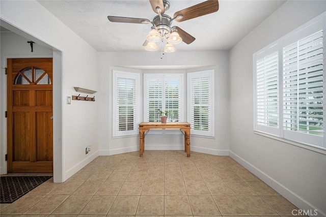 7028 E Parkcrest St, Long Beach, CA 90808 - entryway with light tile patterned flooring and a ceiling fan